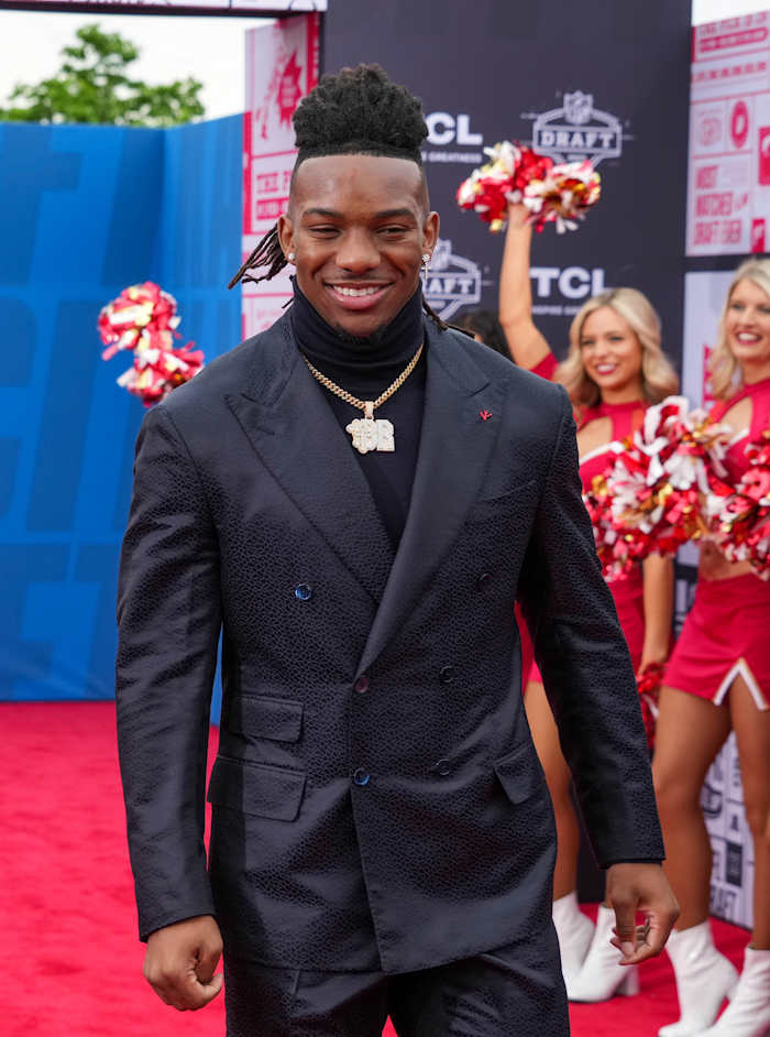 Texas running back Bijan Robinson walks on the NFL Draft Red Carpet before the first round of the 2023 NFL Draft at Union Station.